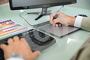 Businessman using graphic tablet