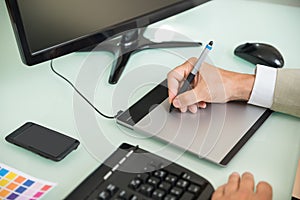 Businessman using graphic tablet