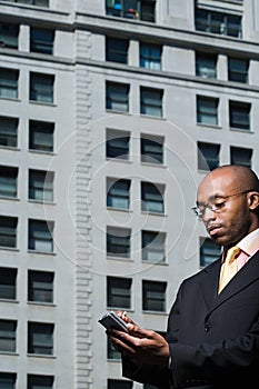 Businessman using handheld computer