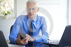 Businessman using his mobile phone