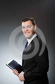 The businessman using his tablet computer in business concept