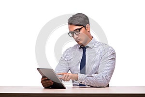 The businessman using his tablet computer isolated on white