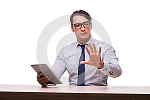 The businessman using his tablet computer isolated on white