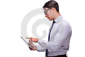 The businessman using his tablet computer isolated on white