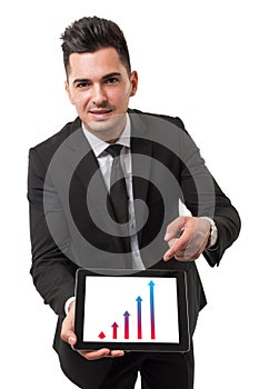 Businessman using his tablet to show performance