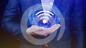 Businessman using holding with wifi icon. Social network business communication concept, Wifi wireless concept free network