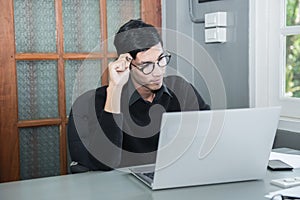 Businessman using ideas while working with labtop at office