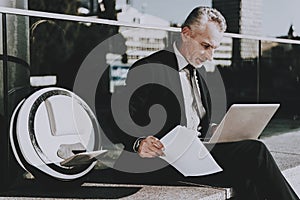 Businessman is Using a Laptop Computer