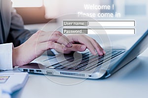 Businessman using laptop loging in to website, business security