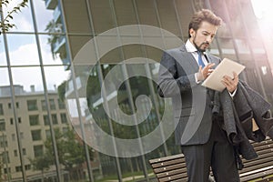 Businessman using a laptop outdoor