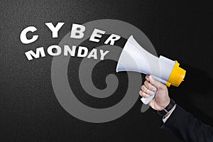 Businessman using a megaphone to announce Cyber Monday