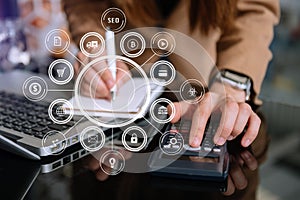 Businessman using mobile phone and laptop computer on white desk big data analytics with business intelligence concept. with VR