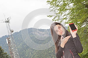 Businessman using mobile phone, with satellite dish telecom network on telecommunication tower at sunrise in rural city. Young gir