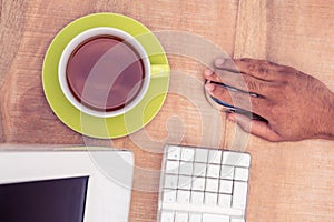 Businessman using mouse while working at table