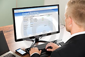 Businessman using online banking service