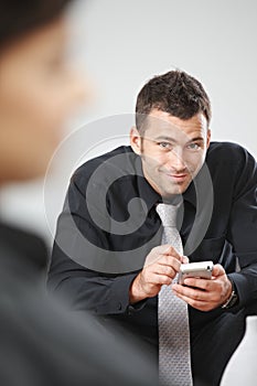 Businessman using palmtop photo