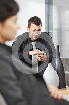 Businessman using palmtop