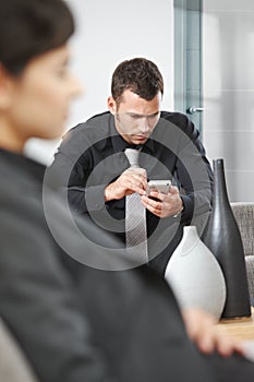 Businessman using palmtop