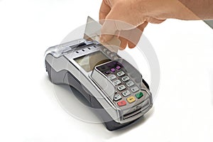 Businessman using payment terminal to pay with credit card