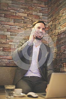 Businessman using phone in the office.