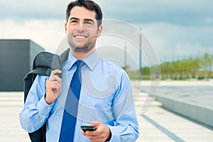 Businessman using phone on travel