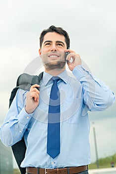 Businessman using phone on travel
