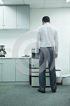 Businessman Using Photocopier