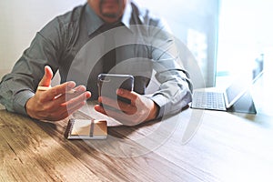 businessman using smart phone and keyboard dock digital tablet.Worldwide network connection technology interface.on marble