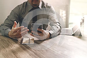 businessman using smart phone and keyboard dock digital tablet.Worldwide network connection technology interface.on marble