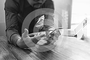 businessman using smart phone and keyboard dock digital tablet.Worldwide network connection technology interface.on wooden