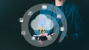 Businessman using a smartphone for cloud computing, data transfer, and digital file management, Concept for server storage,