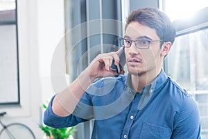 handsome businessman using smartphone
