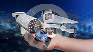 Businessman using a smartphone with a Security camera system and