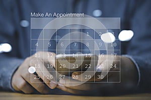 Businessman using smartphone to reserve business schedule plan on virtual screen calendar , Project management concept