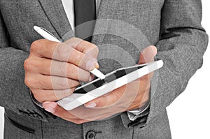 Businessman using a stylus pen in his tablet photo