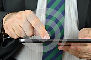 Businessman is using a tablet