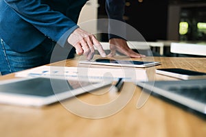 Businessman using tablet analyse data.