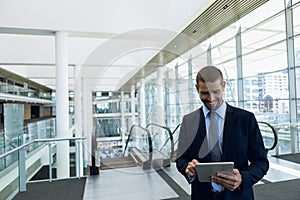 Businessman using tablet computer at work