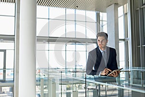 Businessman using tablet computer at work