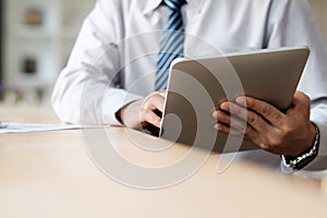 Businessman using tablet connecting wifi