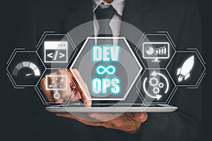 Businessman using tablet with DevOps icon on virtual screen, Methodology development operations agil programming