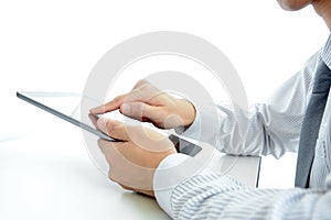 Businessman using tablet pc on the table