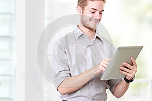 Businessman using tablet pc on white background
