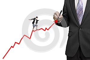 Businessman using tablet and surfing on growth red arrow