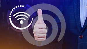 Businessman using thumb up with wifi icon. Social network business communication concept, Wifi wireless concept free network