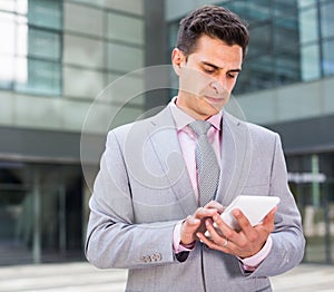 Businessman using touchscreen phone