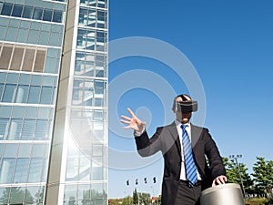 Businessman using virtual reality glasses in a business center