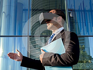 Businessman using virtual reality glasses for a meeting in cyberspace
