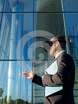 Businessman using virtual reality glasses for a meeting in cyberspace