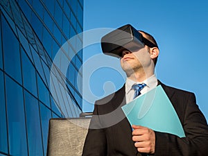 Businessman using virtual reality glasses for a meeting in cyberspace.